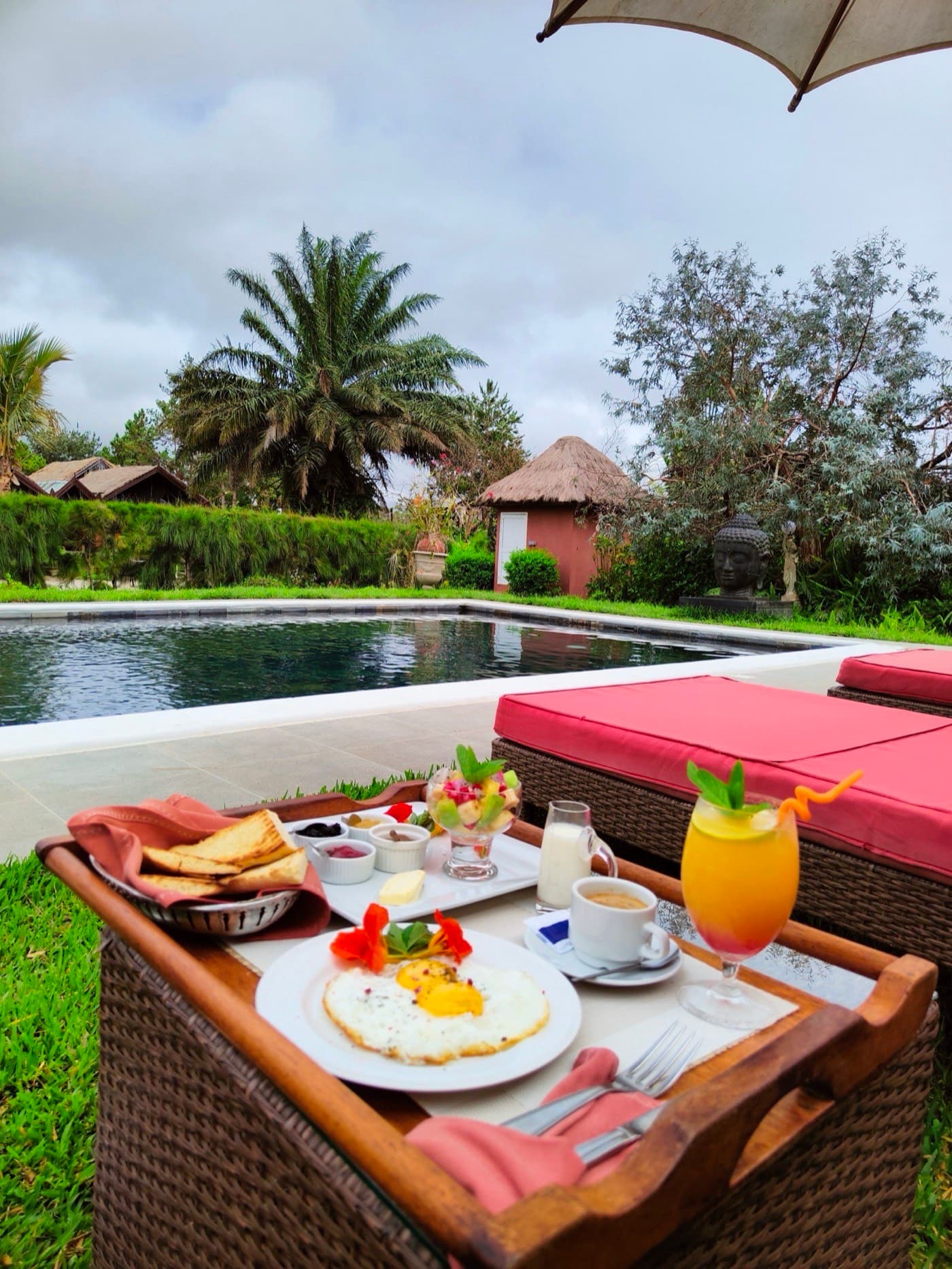 Breakfast served beside the pool, overlooking Lake Sahambavy
